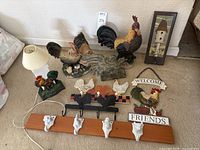 Full overview of all chicken-themed decor including lamp, large figurines, signs and peg board