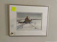 Framed, matted giclee print featuring a winter barn scene signed and numbered by artist Don Musselman.