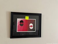 Framed original abstract acrylic painting by Amelia Musselman showing red, pink, black, and white geometric shapes.
