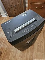 Front top view showing control panel, power and jam indicator lights, and paper feed slot.