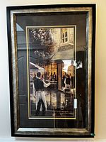 Framed print artwork displayed on wall showing the full artwork and frame.