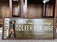 Whole view of the wooden golfer for hire sign showing the golfer figure and text on the sign.