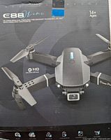 Front view of the E88 box showing drone image with details on dual HD cameras and folding design.