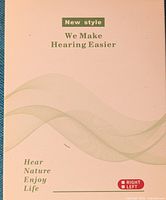 White and green packaging with 'New style We Make Hearing Easier' printed on front.
