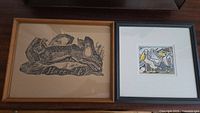 Two framed artworks shown side by side: left is a hare animal print, right is a colorful birds artwork.