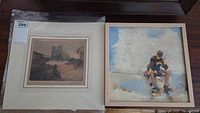 Overview of both paintings side by side on table; shows matting on left and frame style on right