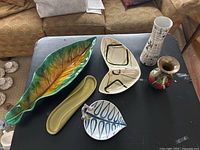 Overview of all six items on black table