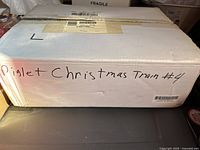 Box labeled 'Piglet Christmas Train #4',' indicates the set theme and content.