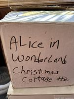 Box labeled "Alice in Wonderland Christmas Cottage #2"