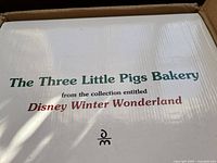 Box label showing The Three Little Pigs Bakery from Disney Winter Wonderland collection.