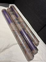 Three unopened rolls of Liberty Ianthe wallpaper, still in original shrink wrap.