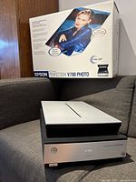 Scanner unit next to original packaging box