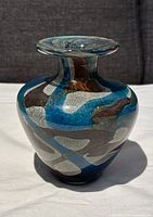 Full view of the hand blown glass vase showing multi-color pattern and overall shape