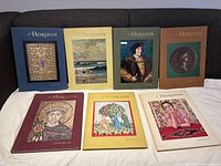 Seven hardcover Horizon magazines arranged on a couch, covers displaying varied artistic images including a mosaic, seascape, Renaissance portrait, coin, and painted figures.