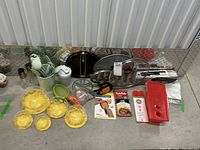 Overview photo showing full kitchen lot including vintage bowls, utensils, splatter screen, multi-chopper, and other items