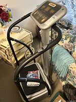 Full view of assembled vibration machine in living room setting