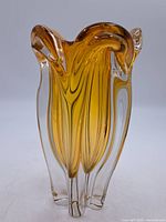 Full front view of heavy amber Murano glass vase showing its intricate organic shape and clear glass accents.