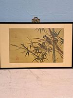 Full view of framed vintage Chinese silk painting showing two birds on bamboo branches.