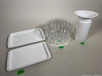 Lot showing the white Rosenthal porcelain vase, clear Orrefors crystal fleur bowl, and two rectangular white Thomas porcelain serving trays side by side.