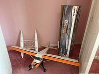 Front view of RC airplane, floats and original box