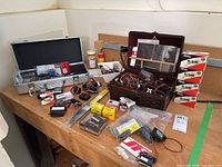 Overview of bench with aluminum and wooden cases, servo boxes and loose components