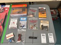 Overview of all RC plane parts spread on grey table
