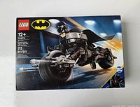 Front view of the sealed LEGO Batman set featuring Batman on the Bat-Pod bike with logos and age recommendation.