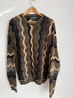 Front view of vintage knit sweater with multicolor wave pattern