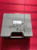 Gray plastic carrying case with label #48 and handwritten marking 'Vintage Harvest'.