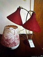 Both table lamps side by side on wooden surface