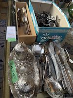 Overview of various flatware pieces including spoons, forks, knives, serving utensils and the ornate Turkish coffee set on decorative tray.