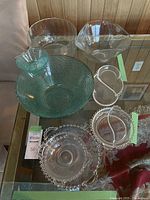 Overview of seven vintage glass pieces including turquoise chip and dip bowl, clear glass bowls, and Imperial Glass Candlewick serving dishes and plates.