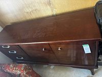 Front view showing three drawers on left and two-door cabinet on right