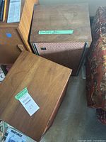 Two JBL speakers side by side with top surfaces visible