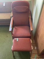 Full view of armchair and ottoman showing overall design and condition