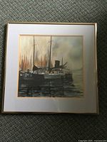 Full view of the framed painting showing multiple boats docked with reflections in the water, matted and framed with gold-tone frame.