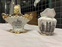 Front view of small ceramic basket with transfer print of Hamilton Court House and creamer with Ottawa Post Office print
