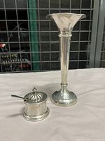 Bud vase, mustard pot with lid and matching spoon on neutral background