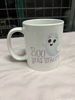 Front side of mug showing ghost character with 'Boo You Whore' text