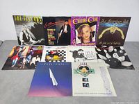 10 vinyl LP albums in a group laid out visibly showing front cover art including various bands and artists.