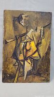 Frontal view of the cubist style figure painting on board showing geometric shapes and earthy tone colors.