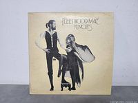 Front of Fleetwood Mac Rumours album cover with band members image and title.