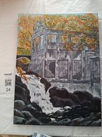 Front view of the full painting displaying a building beside a waterfall with autumn trees in the background.