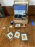 Photo showing various gold leaf decorative frames, stands, and an Empress 8x10 photo frame