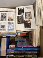 Photo showing stacked books including Reader's Digest Select Editions and books on Scotland and Nova Scotia