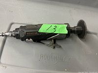 Mastercraft air grinder showing side profile with cutting disc attached, placed on a Roughneck surface.