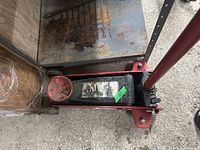 Top view of the floor jack showing the lifting pad, frame and part of handle layout.