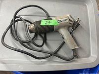 Photo of the Upper Zipper 1200 heat tool with attached power cord and plug, showing overall condition and model labels.