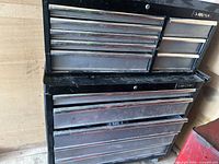 Front view of two-piece Husky tool chest showing top and bottom units with multiple drawers