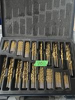 Photo of open Mastercraft drill bit case showing multiple bits in various sizes and some missing from slots.